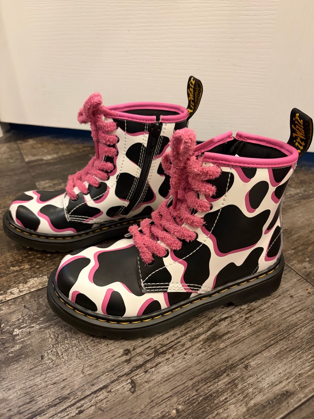 Dr Martin’s Black & White Cow Print Combat Boots with Pink Trim and Laces